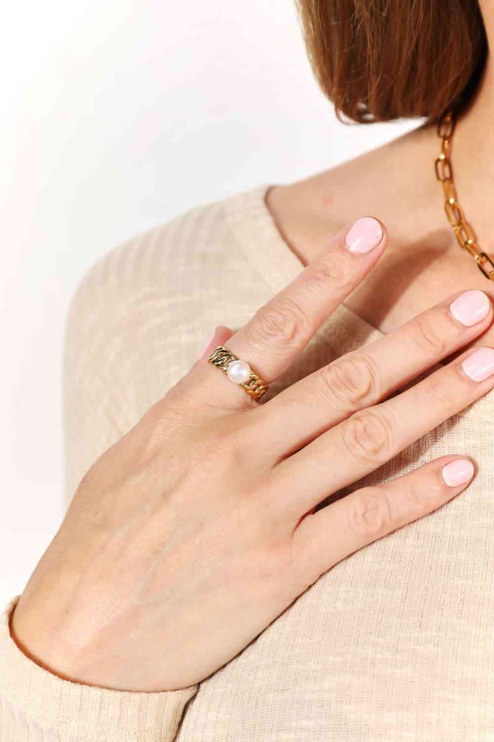 Minimalist open ring with pearl accent, 18K gold-plated stainless steel.