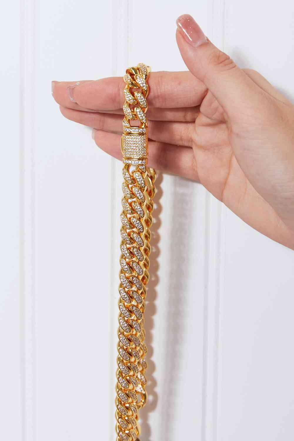 Brass curb chain necklace with cubic zirconia accent – 18-inch length, flat lay style.