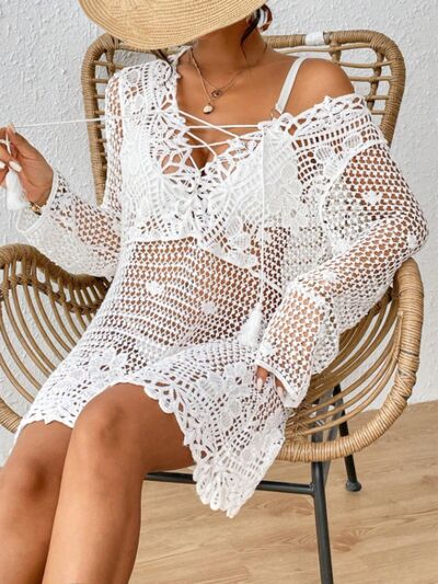 Cutout Tied V-Neck Long Sleeve Cover Up in acrylic material with stylish tied detail and long sleeves.