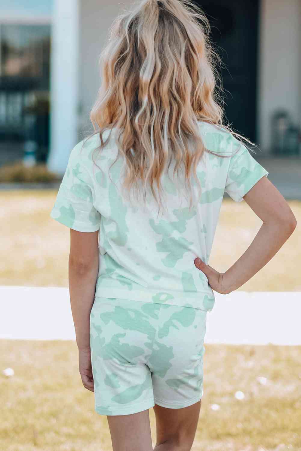 Girls Printed Letter Graphic Lounge Set with short sleeve tee and elastic waistband pants, made from 95% polyester and 5% spandex, available for ages 4-11 years.