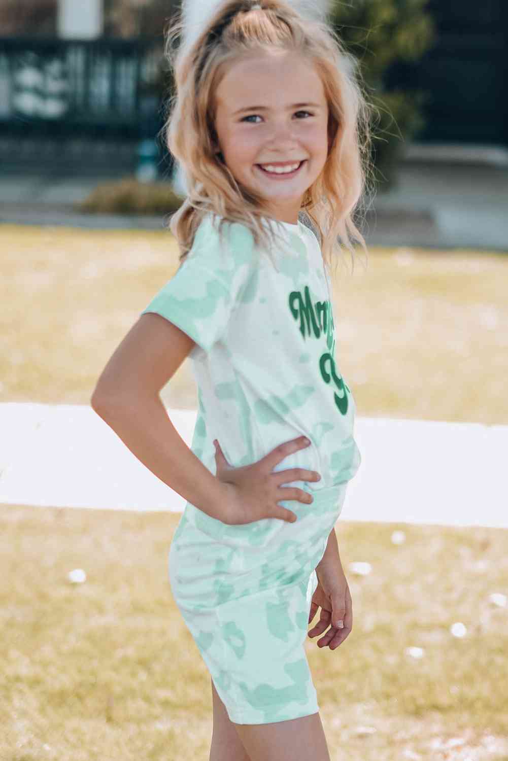 Girls Printed Letter Graphic Lounge Set with short sleeve tee and elastic waistband pants, made from 95% polyester and 5% spandex, available for ages 4-11 years.