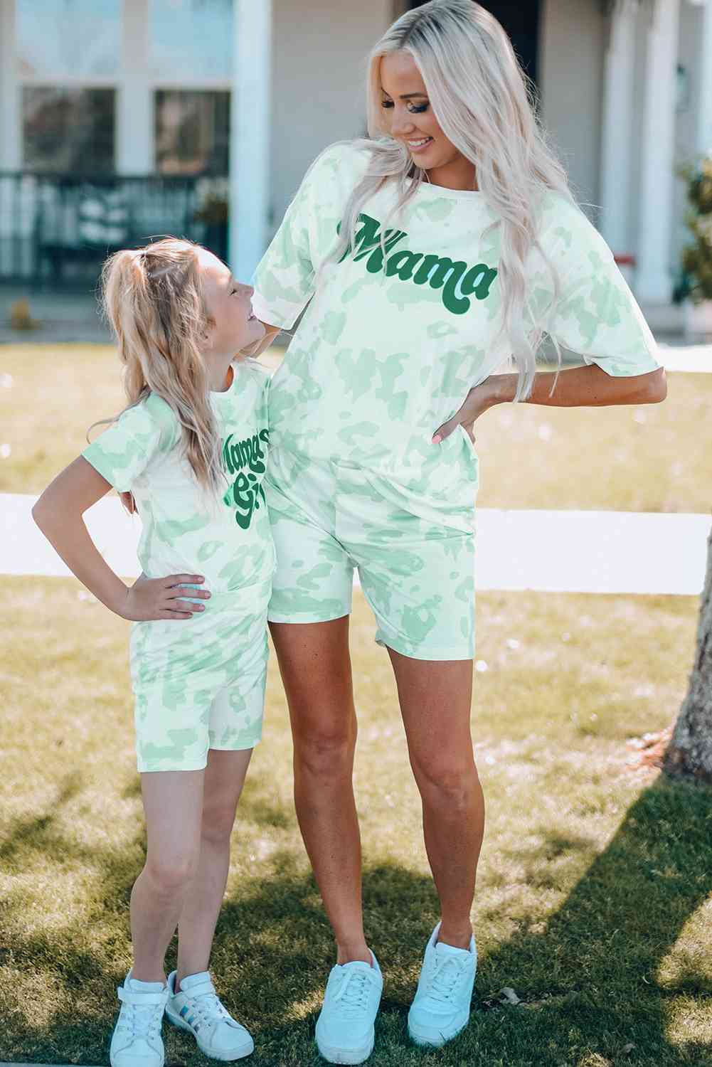 Girls Printed Letter Graphic Lounge Set with short sleeve tee and elastic waistband pants, made from 95% polyester and 5% spandex, available for ages 4-11 years.