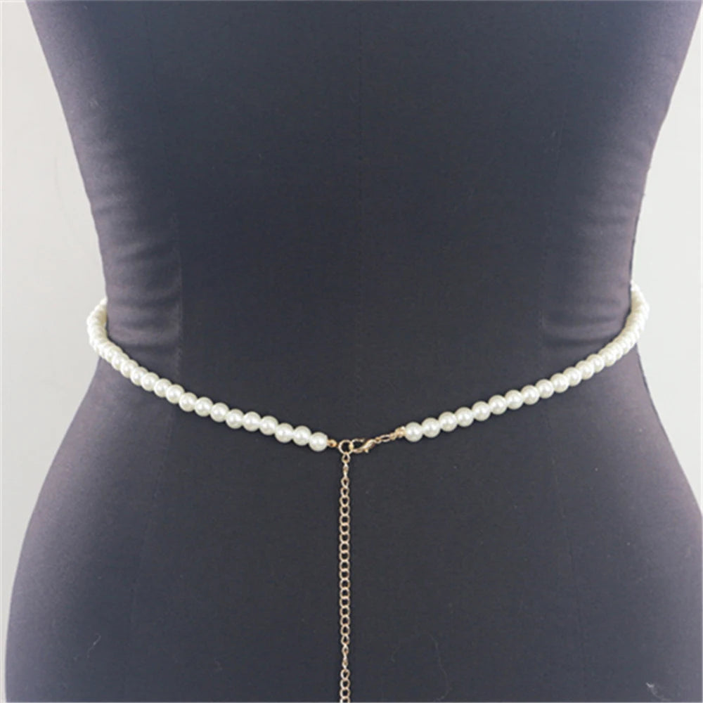 "Close-up of imitation pearl body chain with adjustable fit"