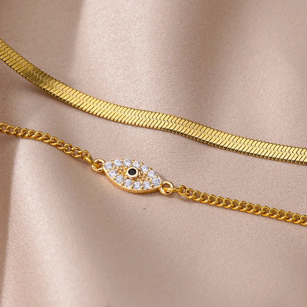 "Boho Evil Eye Anklet for Women with Cubic Zirconia"
"Stainless Steel Evil Eye Anklet for Lucky Summer Style"
"Trendy Beach Jewelry Anklet with Snake Chain and Evil Eye Design"