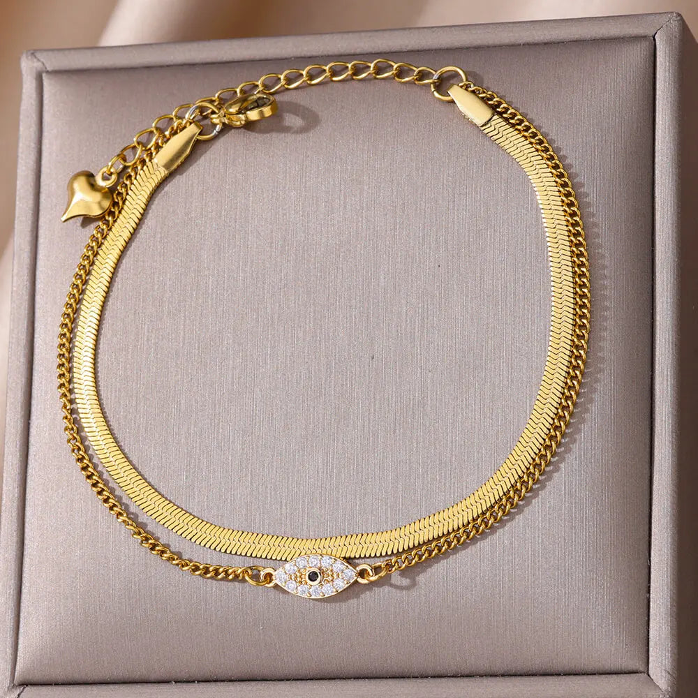 "Boho Evil Eye Anklet for Women with Cubic Zirconia"
"Stainless Steel Evil Eye Anklet for Lucky Summer Style"
"Trendy Beach Jewelry Anklet with Snake Chain and Evil Eye Design"