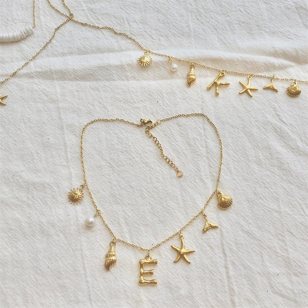 "Personalized Initial Surfer Girl Necklace with Starfish and Pearl Pendant"
"Bohemian Beach Necklace Gift for Women with Initial Pendant"
"Surfer Girl Initial Letter Necklace with Seashell and Starfish"
"Beach Jewelry for Women – Customizable Initial Necklace"