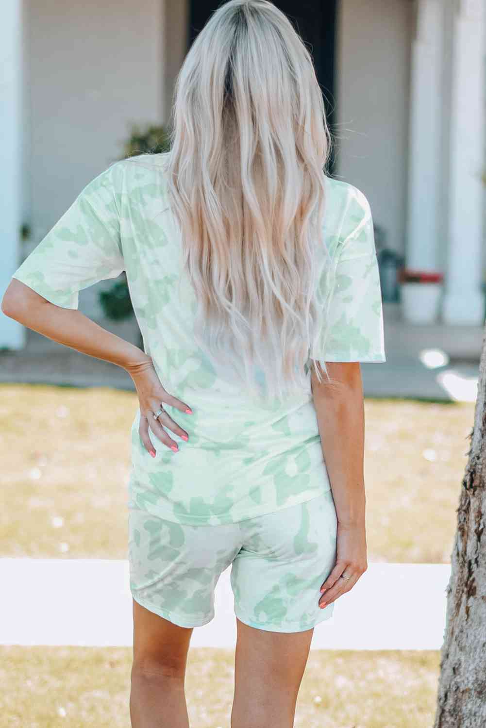 Women Printed Letter Graphic Lounge Set with round neck tee and elastic waistband shorts, made from 95% polyester and 5% spandex. Available in sizes S-2XL.