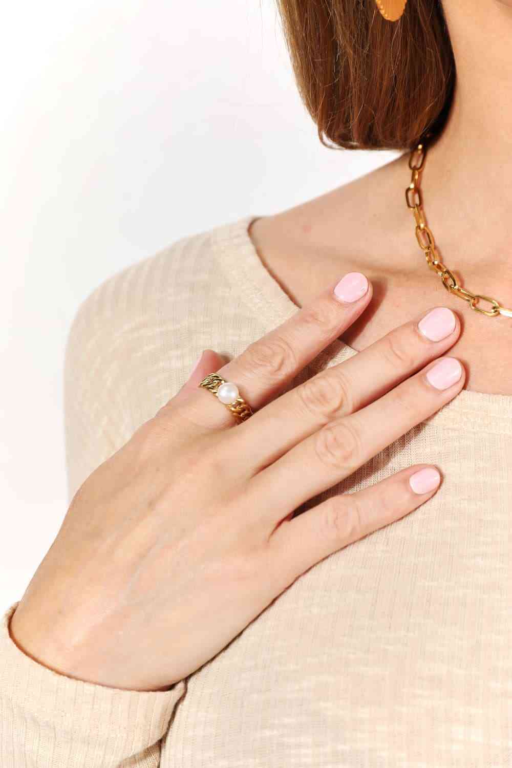 Minimalist open ring with pearl accent, 18K gold-plated stainless steel.