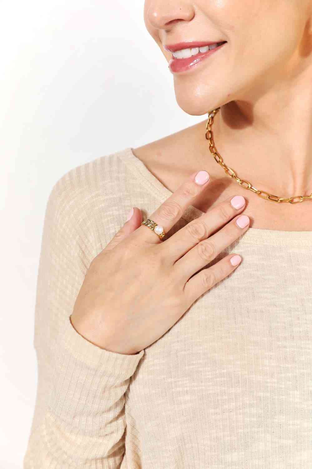 Minimalist open ring with pearl accent, 18K gold-plated stainless steel.